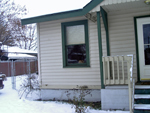 A third view of our house (12/23/06). If you look closely, you can see Foofer's face in the window. Click on image to see larger size in a new window.