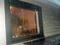 A view of the storm from our back door/kitchen window (06/13/06). Click on picture to see larger size in a new window.